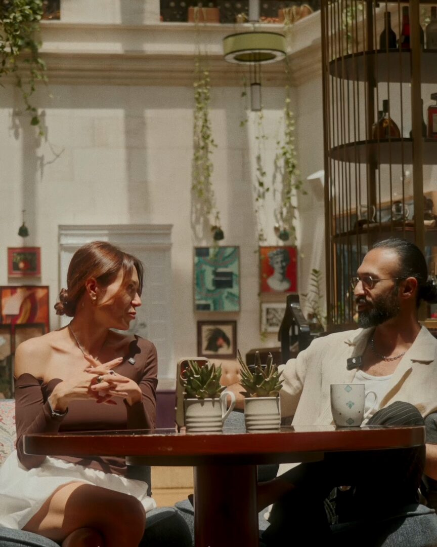 Valeria in conversation with Zaour, a tango teacher.
